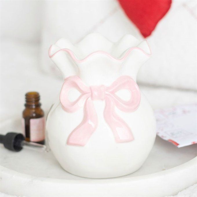 Brûleur avec nœud blanc et rose